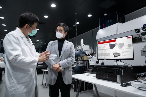 Caption I: New World Development CEO Adrian Cheng (right) listened to Dr. Tom Kong, CEO of Master Dynamic about the characteristics of NanoDiamonds technology. The company's goal is to transfer the antibacterial coating technology applied to jewellery to the non-woven material of surgical masks, thereby blocking and inhibiting bacteria and viruses.