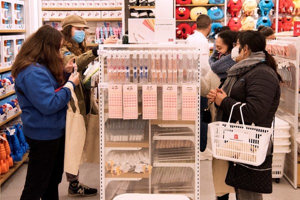 Spanish customers shopping in MINISO stores
