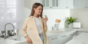 Woman drinking clean tap water