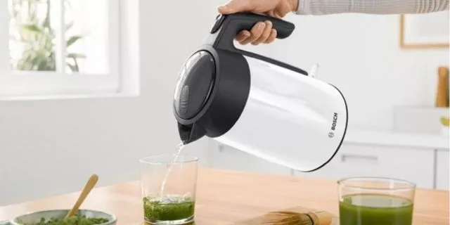 Bosch Kettle pouring hot water into a glass of green tea